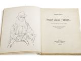 an open book with a drawing of a man sitting on a chair