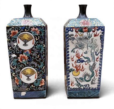 two vases that are sitting side by side on a white surface