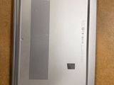 a laptop that is sitting on a table with a mouse