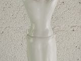 a statue of a woman holding a bowl on her head
