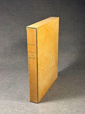 an old book sitting on top of a table next to a gray background