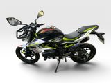 a black and green motorcycle parked on a white surface