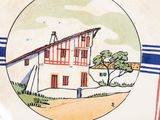 a picture of a plate with a picture of a house on it