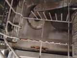 a dirty dishwasher inside of a dishwasher