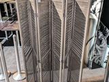 a room divider with a gold leaf design on it