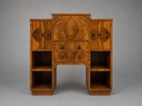 a wooden desk with two shelves and a drawer on top of it