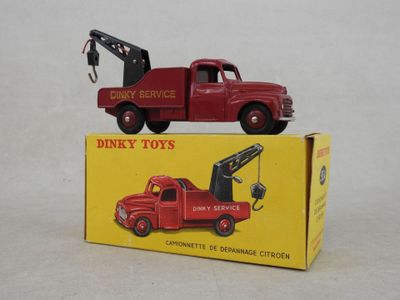 a red toy truck with a crane on top of it