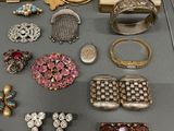 many different types of jewelry on the table
