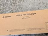 a cardboard box with a picture of a ceiling fan on it