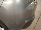 a close up of a car ' s rear end with a sticker on it