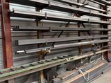 a large amount of steel bars stacked up in a warehouse