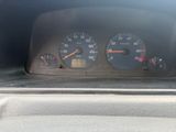a close up of a car dashboard with a speedometer and gauges