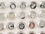 a lot of different types of buttons on a white surface