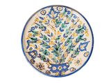 une assiette bleue et jaune ornée d'un motif floral