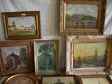 a lot of paintings that are on a table