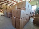 many boxes stacked on top of each other in a warehouse