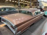 many old cars parked in a garage together