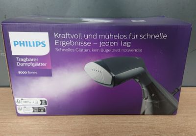 emballage d'un sèche-cheveux Philips posé sur une table