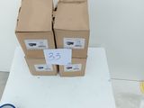 two boxes of paper and a pair of scissors on a table