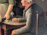 two women sitting at a table playing a game of checkers