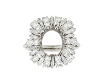 a close up of a diamond ring on a white background