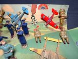 a lot of toy figurines that are on a table