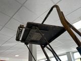 a piece of luggage hanging from the ceiling in a room
