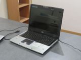 a laptop computer sitting on a table with a mouse next to it