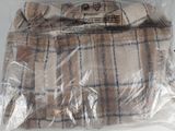 a brown and white plaid blanket wrapped in plastic