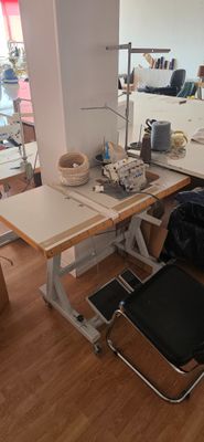 an image of a sewing room with a desk and chair