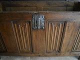an old wooden chest with a metal latch on it