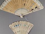 pair of chinese folding fans with blue and white designs