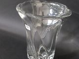 a glass vase that is sitting on a table