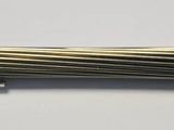 stainless steel wire with a metal tip on a white surface