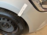 a close up of a car tire with a sticker on it