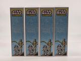three boxes of star wars action figures sit on a white surface
