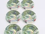 six plates with a painting of a garden scene on them