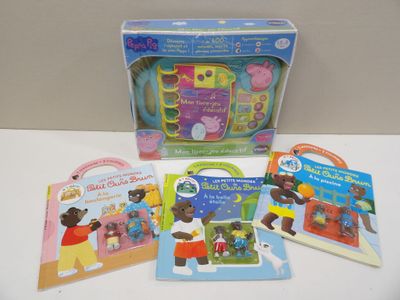five children ' s books in the box on the table
