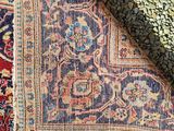 a close up of a rug on a wooden floor