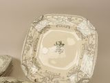 three plates and a bowl sitting on a table