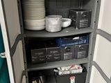 a cabinet with a lot of plates and bowls on it