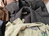 a pile of clothing that is sitting on a table