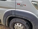 a van that is parked on the side of the road