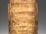 an old wooden chest with carvings on the sides