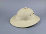 an image of a white hat sitting on top of a blue surface