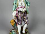 an image of a figurine of a man with a hat and jacket