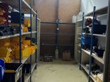 a room filled with lots of shelves and bins