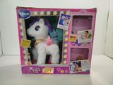 a pink and white stuffed animal in a pink box