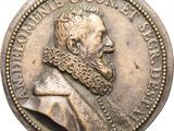 a close up of a coin with a man ' s face on it