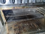 a dirty oven that has a lot of burn on it